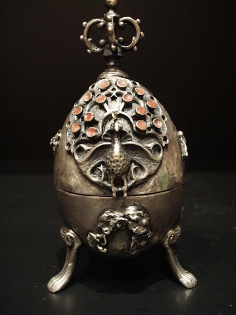 A 19th Century Large Russian -84 Silver Egg - 163 Grams: Vintage, fine 19th century silver and semi-precious stone (or similar)set egg. Stamped 84 Moscow. The top is engraved with peacocks and crown finial. The inside of the egg contains sculpted dog surpri