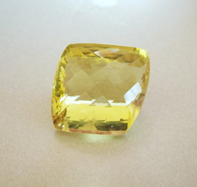 Natural Lemon Topaz Cushion 35.87Ct 19.7x19.4x14mm: Gem Type: Natural Lemon Topaz Qty: 1 Weight: 35.87 Carat Measurement: 19.7x19.4x14mm Shape: Cushion Checkerboard Clarity: VS Color: Light Yellow Origin: Brazil Estimate Value Price $1,470