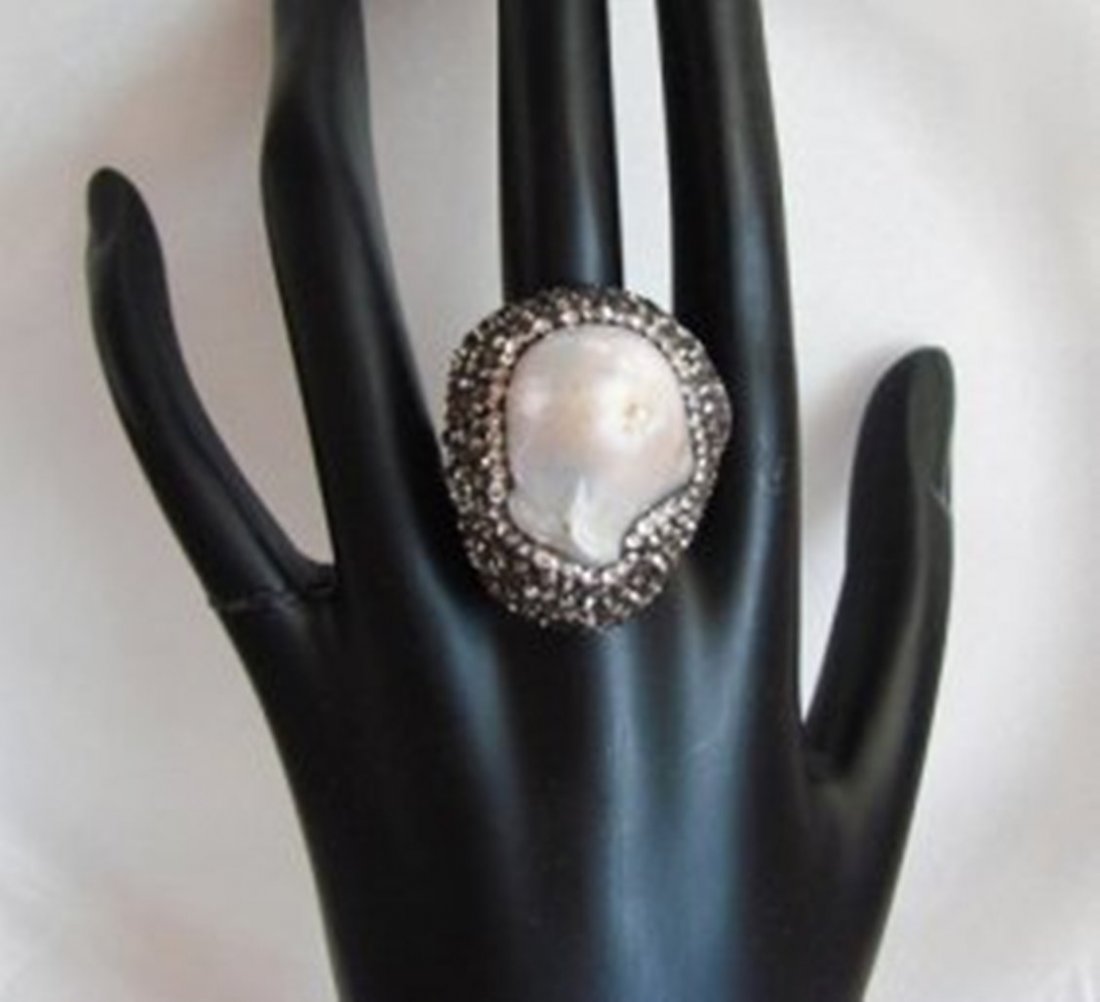 Natural Mabe Pearl Ring 8.36Ct 18k W/G Overlay: Gem Type: Natural Mabe Pearl, Creation, And Diamond, Hematite Crystals Item: Ring (Size: 8) Creation, Diamond weight: .38 Carat Brilliant Clarity: VSI, Color: G Black Hematite Crystals: Approx 2.92car