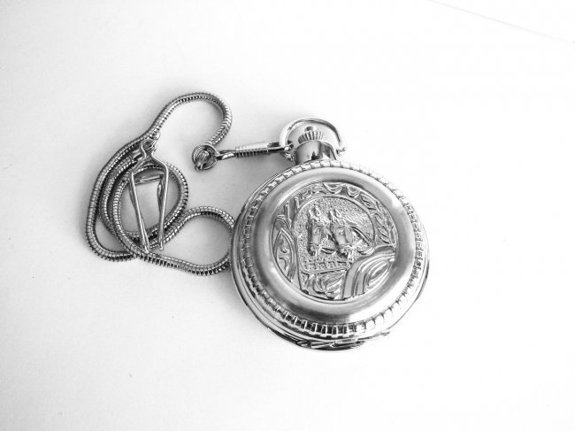 Pocket Watch 'L' Luis Cardini 18k W/g Overlay: Pocket Watch Luis Cardini Quartz Japan Movement,18k White Gold Overlay Carved: Two Horse and Leaf Design on the back side Size:1.3/4" x 1.3/4" Come With Chain 14.5"-Run By Battery Estimated Value Pric