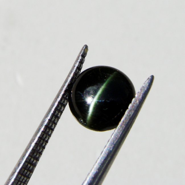 Grayish Brown Sillimanite Cat's Eye Cabochon 2.06Ct: Gem:Natural Sillimanite Cat's Eye Quality: 1 Piece Measurement: 8x3.7 mm Weight: 2.06 Carat Shape Round Cabochon Clarity: Opaque ,Color: Grayish Brown Treatment: None Origin: Madagascar Estimate Value