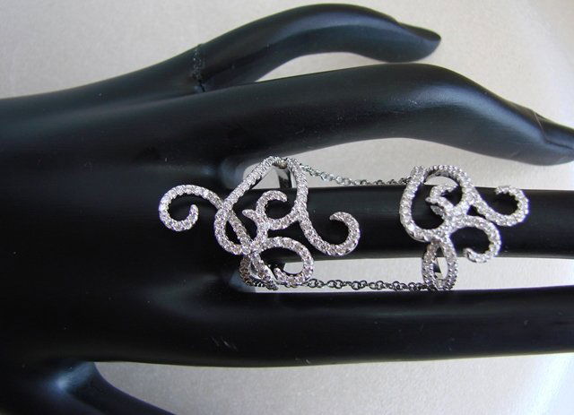 Creation Diamond Stacked Rings 3.03Ct 18K W/G Overlay: Creation Diamond Ring High Quality Item: Name: Stacked Ring with connected chain Creation Diamond: 3.03 Carat Round Brilliant Clarity: VVS, Setting: Micro Pave Metal: 18k white gold overlay 925 silver