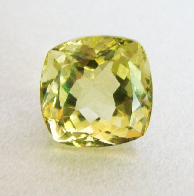 Natural Lemon Topaz Cushion Shape 13.41Ct 14x14x10.7mm: Gem Type: Natural Lemon Topaz Qty: 1 Weight: 13.41 Carat Measurement: 14x14x10.7 mm Shape: Cushion Cut: Facet Cut Clarity: VS Color: Light Yellow Origin: Brazil