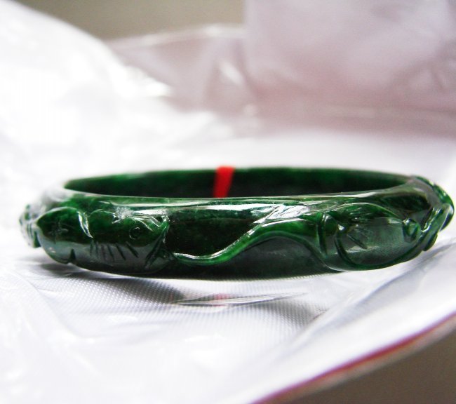 Natural Jade Carved Ruyi&Beaver Imperial Bangle Grade A: Jade Type: Natural Jadeite Jade Imperial Qty: 1 Item: Bangle Grade: A Clarity: Deep Polish, Translucent, Color: Deep Imperial Green Luster: Excellent Origin: Burma Outer Diameter: 65 mm