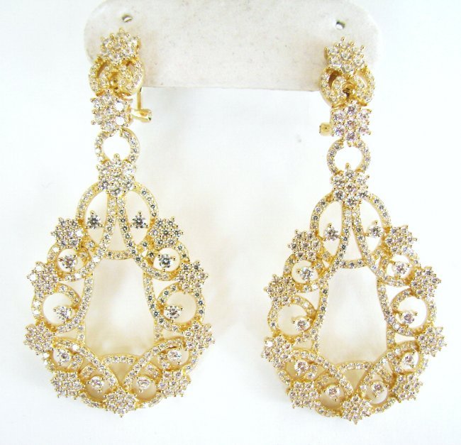 Ceation Diamond Chandeliers Ear 6.32Ct 18k Y/g Overlay: Creation Diamond High Quality Item: Earrings Stone: 6.32 carat Round brilliant Clarity: VVS, Color:F Length: 2.1/2"x Width 1.1/8" inch Setting: Prong 18k Yellow gold overlay 925 silver Weight: 20.08 g