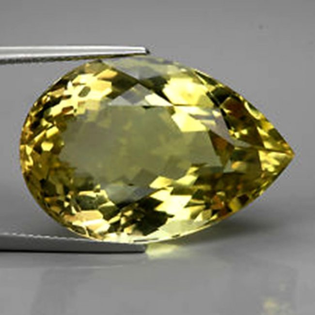 Loose Natural Lemon Topaz Pear Shape 17.22Ct: Gem Type: Natural Lemon Topaz Qty: 1 Weight: 17.22 Carat Measurement: 19.3x14.5x10 mm Shape: Pear Facet Clarity: VS Color: Yellow Origin: Brazil