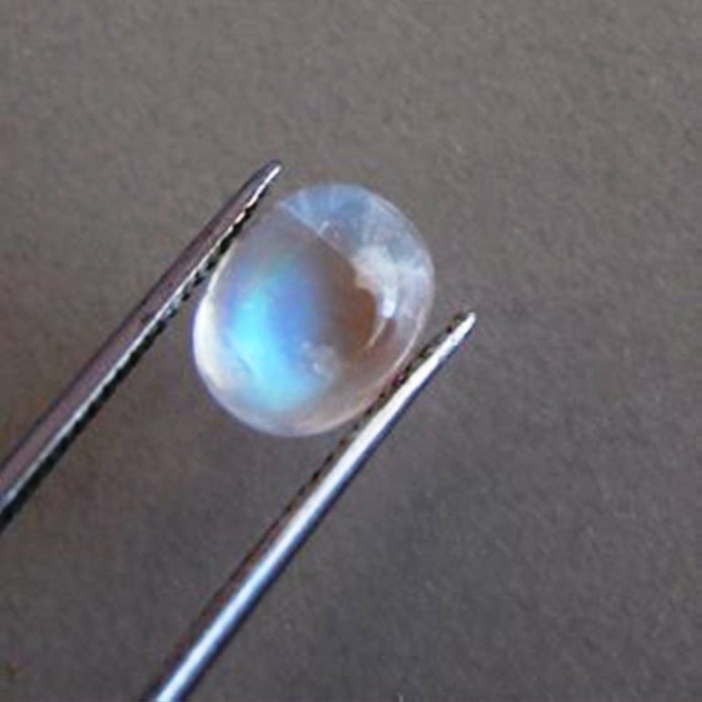 Blue White Rainbow Moonston Oval 3.00Ct 10x8x4.7mm: Gem: Natural Moonstone Qty: 1 Weight: 3.00 Carat Oval Shape Cut: Cabochon Measurement: 10 x 8 x 4.7mm Clarity: Transparent Color: Blue White Rainbow Treatment: None Origin: Sri Lanka (Ceylon)