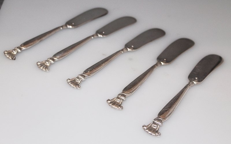 WALLACE ROMANCE OF THE SEA 5 STERLING BUTTER KNIFES: We present for your consideration this collection of 5 solid sterling silver Butter Knifes, classic vintage Pattern Romance of the Sea by Wallace Silversmiths, designed by William S Warren , Solid ste