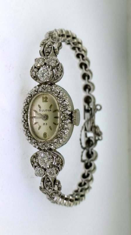 ESTATE LADIES 14k DIAMOND BULOVA BRACELET WATCH: Estate Vintage Ladies 14kt white gold Bulova approximately 2 1/2 cts total weight diamond wrist watch. The watch is approx. 6.75” long with a link style band. There are a total of twenty-two links i