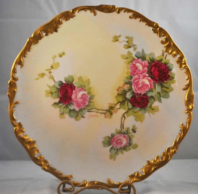 RARE TRESSEMANN & VOGT 1907+ FACTORY HP LIMOGES CHARGER: We are extremely pleased to present this spectacular antique Tressemann & Vogt factory potted and hand painted large sculpted rim charger from 1907 to 1919. This gorgeous 12.5 x 12.5 x 1" charger feat