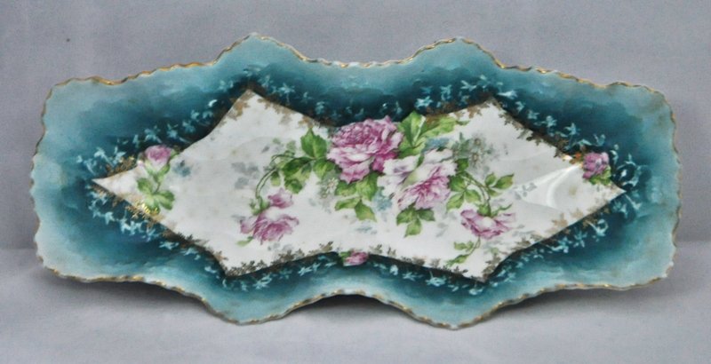 MORITZ ZDEKAUER AUSTRIAN 1910s HP PORCELAIN CELERY DISH: We proudly offer this gorgeous large 11 inch x 2 inch deep sculpted pie crust rim celery serving bowl from the skilled artisans at Moritz Zdekauer of Altrohlau, Bohemia. The beautiful tea roses over t