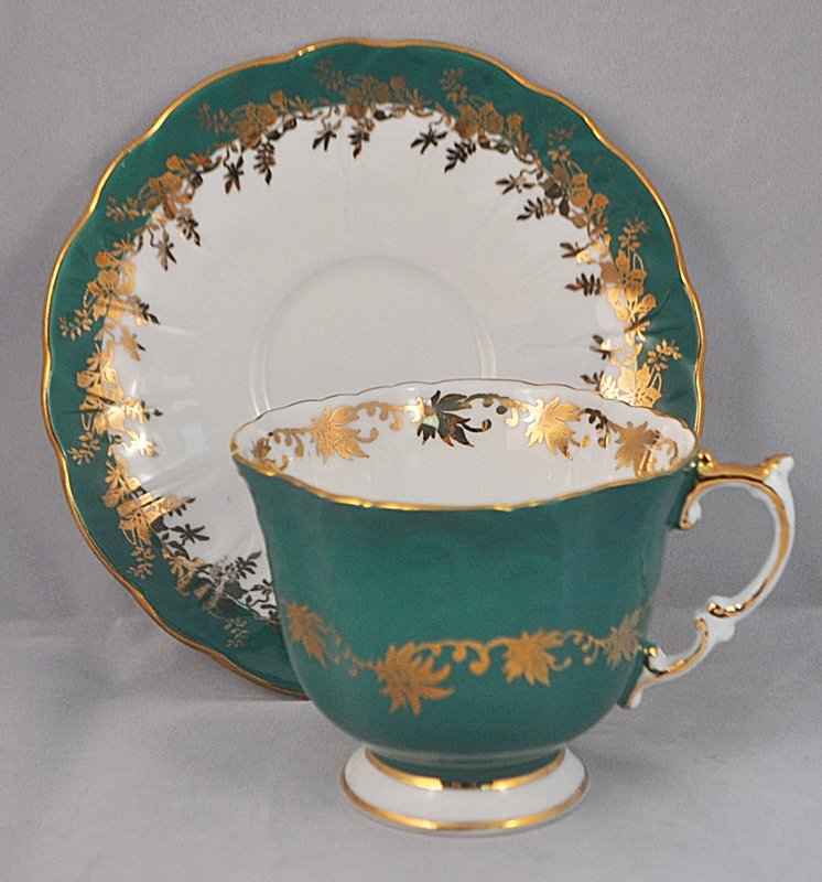 AYNSLEY 1950 HP TEAL GILT SCALLOPED RIM CUP SAUCER: The AEAA is extremely proud to showcase this next of our magnificent collection of antique and vintage hand painted, matched cup and saucer sets from England and Europe. Our pair represents still anot