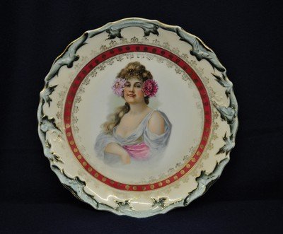 BAVARIAN 1930s MAIDEN PORTRAIT TRANSFER WALL PLAQUE XW: We are pleased to offer this gorgeous factory drilled wall plaque from Bavaria in the 1930s. This full sized transfer & hand accented 9.625 x 9.625 x 1.25" plaque features a subtle scalloped rim, and 