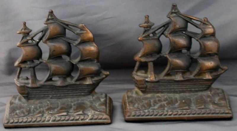 OLD IRONSIDES CLIPPER SHIP BOOKENDS CAST IRON: Vintage Old Ironsides, plated Cast Iron bookends. In good condition measures 6 X 2 X 6 Tall. Copper Wash. Stamped Old Ironsides. *Provenance: Dr. Douglas D. Ashley Estate, Charleston SC For Shipping W