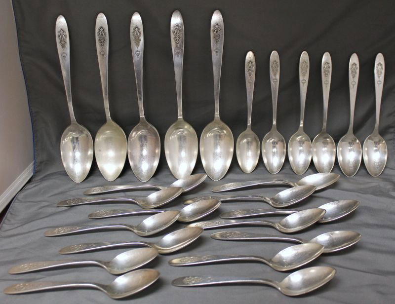 25PC 1923 BIRD OF PARADISE SILVERPLATE SPOONS: Lot of 20 c. 1923 Onieda Community Plate Teaspoons and 5 Serving Spoons in the Bird of Paradise pattern. The ad from 1923 says "Announcing the Bird of Paradise. Never have we produced a design which h