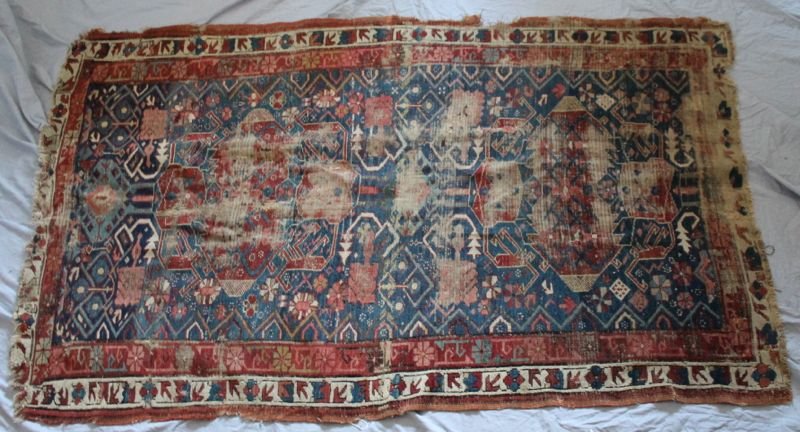 ANTIQUE KURD PERSIAN OLD RUG 6FTX3.5FT: Antique Kurdish Persian Carpet. The rug is very worn. Repaired in spots. A very old better oriental. *Provenance: Dr. Douglas D. Ashley Estate, Charleston SC To Ship Folded Weight :7 pds Measurements: