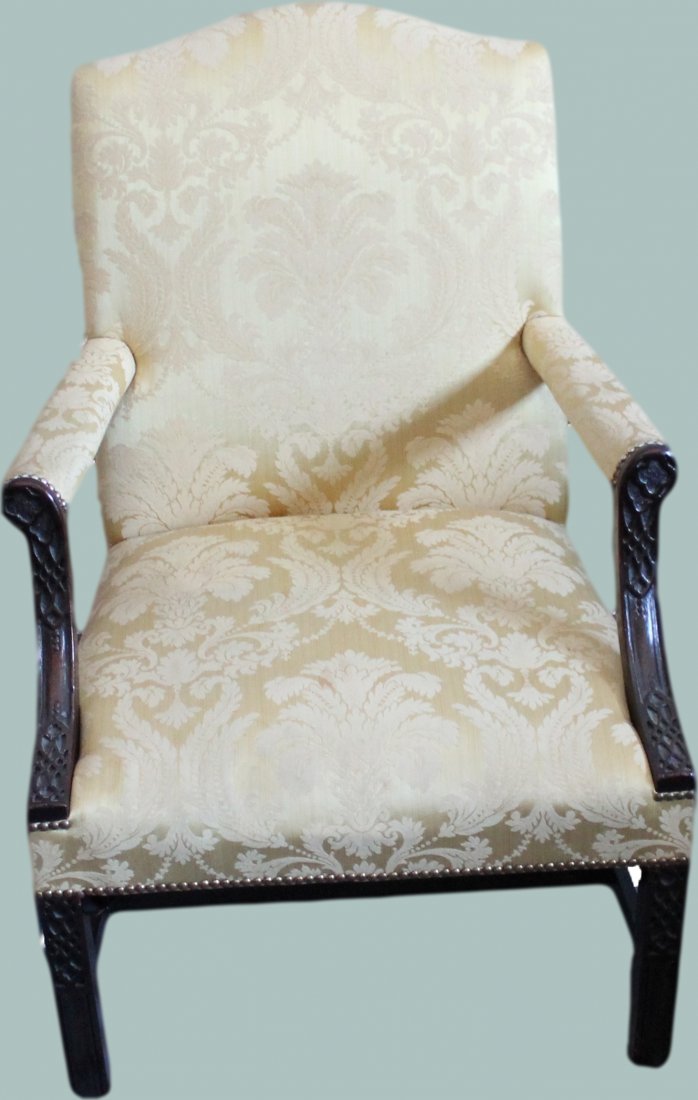 ANTIQUE PERIOD HEPPLEWHITE CARVED LOLLING CHAIR: Antique period Hepplewhite Lolling Chair. Composed of a dark carved mahogany with appropriate straight leg configuration. Exceptional carved detailing, beautiful cream brocade upholstery *Provenance: 