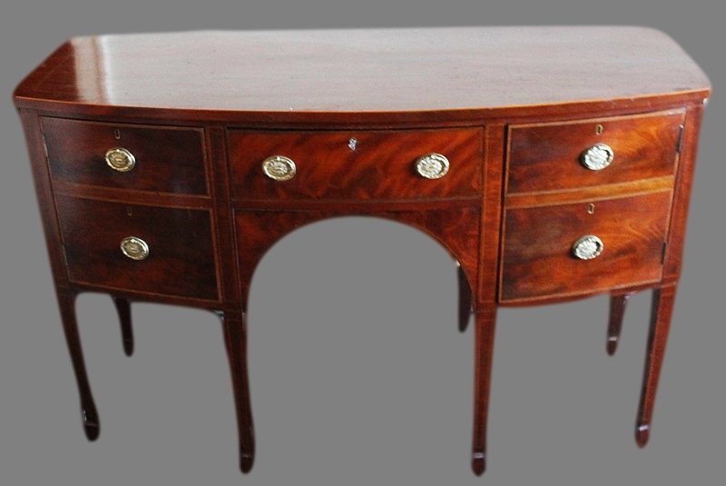 ANTIQUE HEPPLEWHITE FLAME MAHOGANY BOWFRONT SIDEBOARD: Antique 19th c. Hepplewhite flame mahogany bowfront sideboard, the top and drawers with satinwood banding. A arched frieze flanked by cupboards,on tapered square legs terminating in spade feet. Lock a