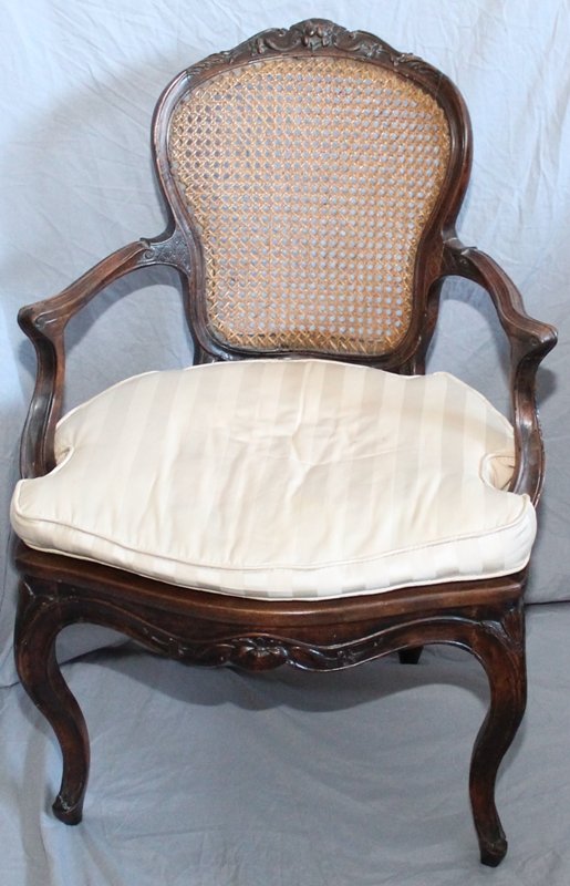 ANTIQUE FRENCH LOUIS XV STYLE FAUTEUIL CHAIR CANE BACK: Antique French Louis XV style Fauteuil Cane Chair. The chair is a older one, 19th c. Custom upholstered pillow for seat. Beautifully carved crest and sides, carved skirt on cabriole legs. There is a s
