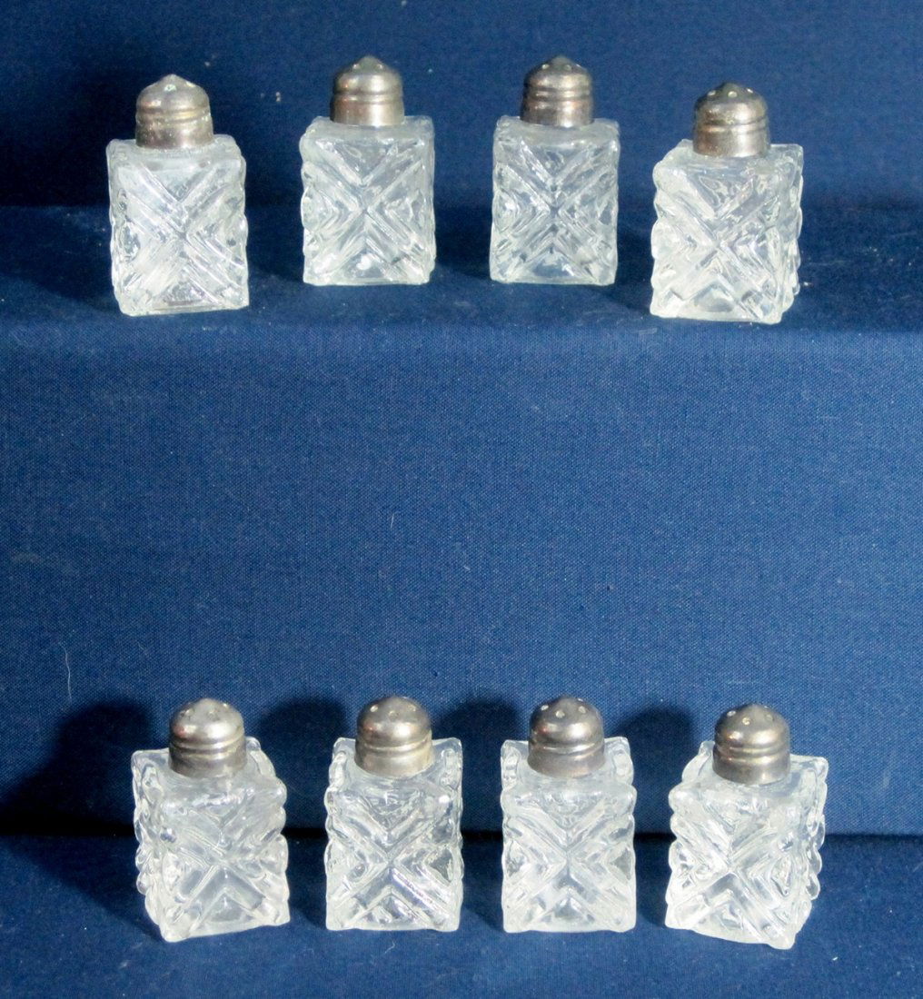 EALES OF SHEFFIELD SILVER PLATE 8PC IND SALT SHAKERS XR: We are pleased to offer this eight piece set of crystal individual Salt & Pepper Shakers. These are made by Eales of Sheffield, England with Silverplate tops. The front design is a simple X pattern cu