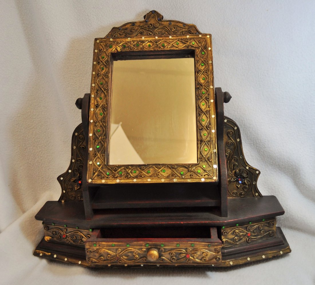 DRESSER TOP TILT SHAVING MIRROR & GROOMING DRAWERS XW: We are very pleased to offer this mid 20th century decorative wood dresser top vanity with dual accessory drawers and an adjustable tilt mirror. The wood is highly ornate, and is adorned with colored 