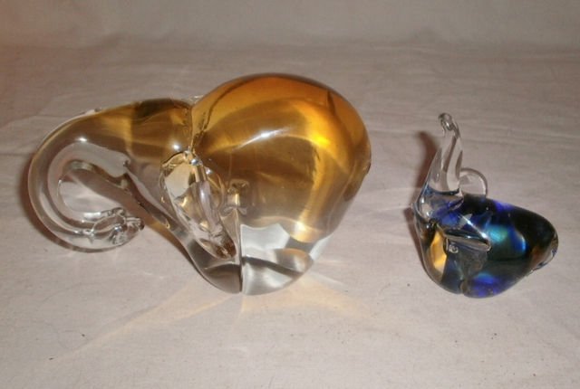 HB CZECH, MURANO 1970s CRYSTAL ELEPHANT PAPERWEIGHTS XC: We are pleased to offer this handsome pair of 1970s hand blown crystal elephant paperweights from Czechoslovakia and Murano. The larger Czech elephant has a special curled trunk & long ears, and a lov