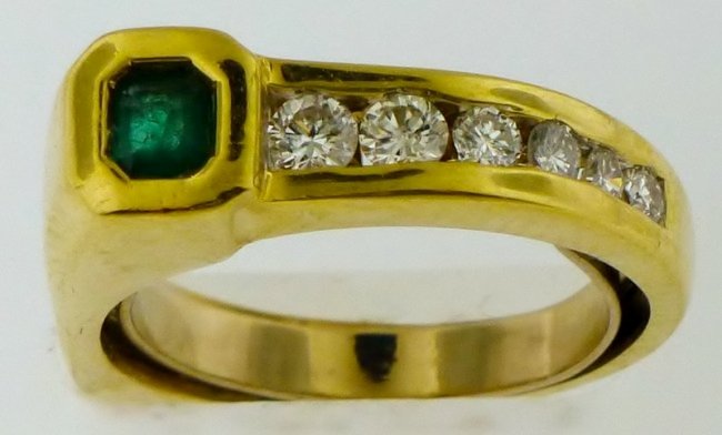 EMERALD AND DIAMONDS 14K YELLOW GOLD RING XC: A vintage 14 Karat Yellow Gold, Diamond and Emerald Ring, containing six round brilliant diamonds weighing approximately 0.21 carat total and one square step cut emerald measuring 3.26 mm x 2.75 mm. 3