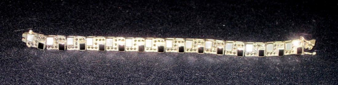 1970s DECO 31gm STERLING MOP ONYX MARCASITE BRACELET XR: We are pleased to offer this Vintage 1970s Mother of Pearl, Onyx and Marcasite Bracelet. The photos do not do this well-made, heavy, unusual Sterling Silver bracelet justice, its a knockout at 31 gram