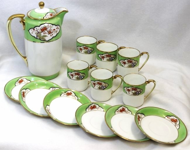 PRE 1921 MORIMURA EXPORT NIPPON HP CHOCOLATE SET XW: We proudly offer this wonderful pre 1921 Nippon chocolate set, featuring original hand painted Morimura Bros imported items, representing a cylindrical pot and (6) matching cups and saucers. All are f