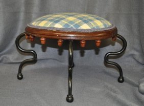 ANTIQUE AMERICAN ARTS & CRAFT FOOT STOOL XW: We are pleased to offer this Antique Oak and Wrought Iron Footstool. Beautiful oak upholstered top with acorn drop finials. Curved shaped wrought iron legs, reupholstered in a contemporary plaid fabri