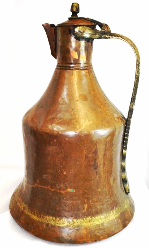 GIANT HD HAMMERED COPPER BRASS HANDLE WINE PITCHER XT: We are very pleased to present this mammoth 13 x 13 x 20.5 inch tall hand hammered Indian copper pitcher, with a lattice accented brass handle (and joiner work) from the 1960s-1970s. The weight of thi