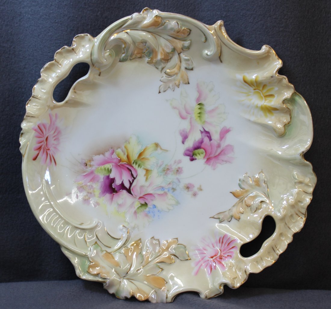 1898 RS IRREGULAR STEEPLE MOLD 22 FLORAL CAKE PLATE XW: We are exceptionally pleased to present this Rare & stunning 1898-1903 Reinhold Schlegelmilch large RS Steeple mold #22, hand painted integral handled cake plate. This Rare Tillowitz factory example i