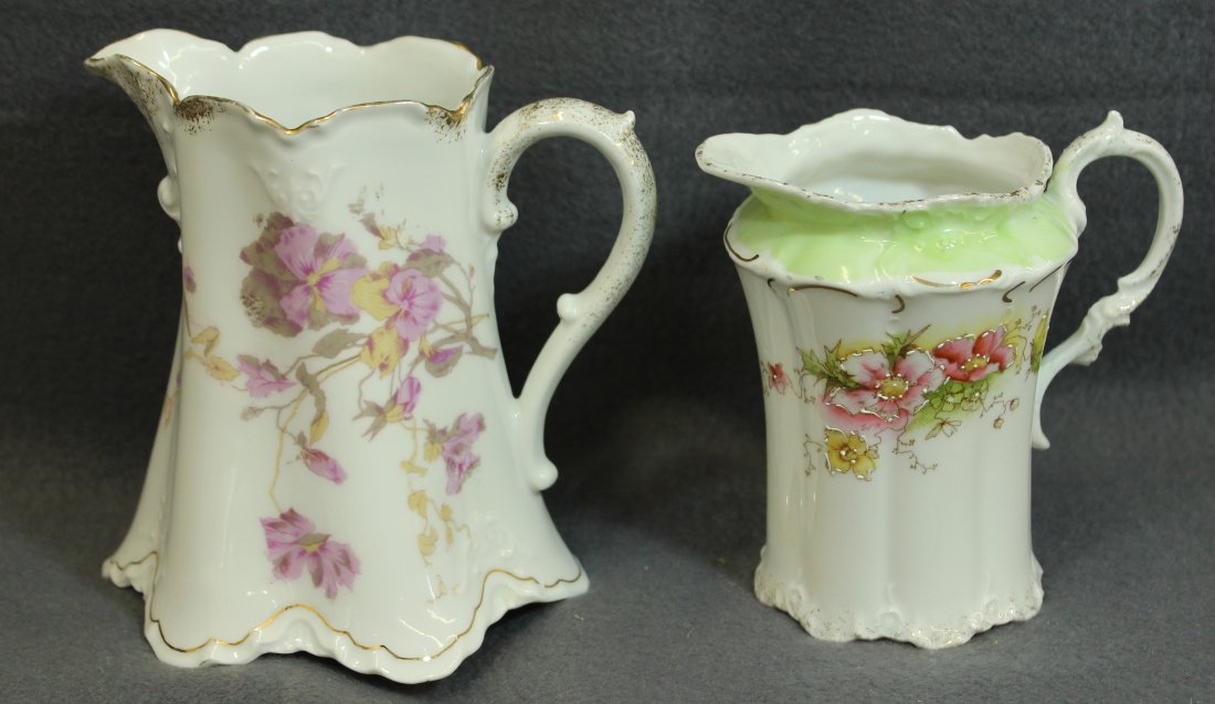 1910s RS PRUSSIA STAR, 20s HERMANN OHME HP CREAMERS XJ: We are very pleased to present this wonderful pair of German hand painted floral porcelain creamers from Reinhold Schlegelmilch (RS), and from Hermann Ohme. The smaller creamer carries the R.H. Capers