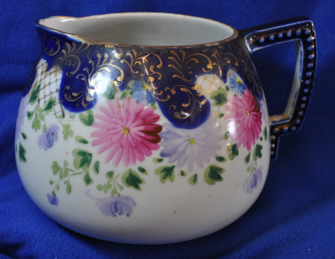 HAND PAINTED NIPPON 1930's CIDER / JUICE PITCHER XW: Offered for your consideration this stunning 1930's hand painted cobalt Cider/Juice Pitcher, it bears no mark as it was not made for export , gilded scrolls and lattice work accent Chrysanthemum's. Wh