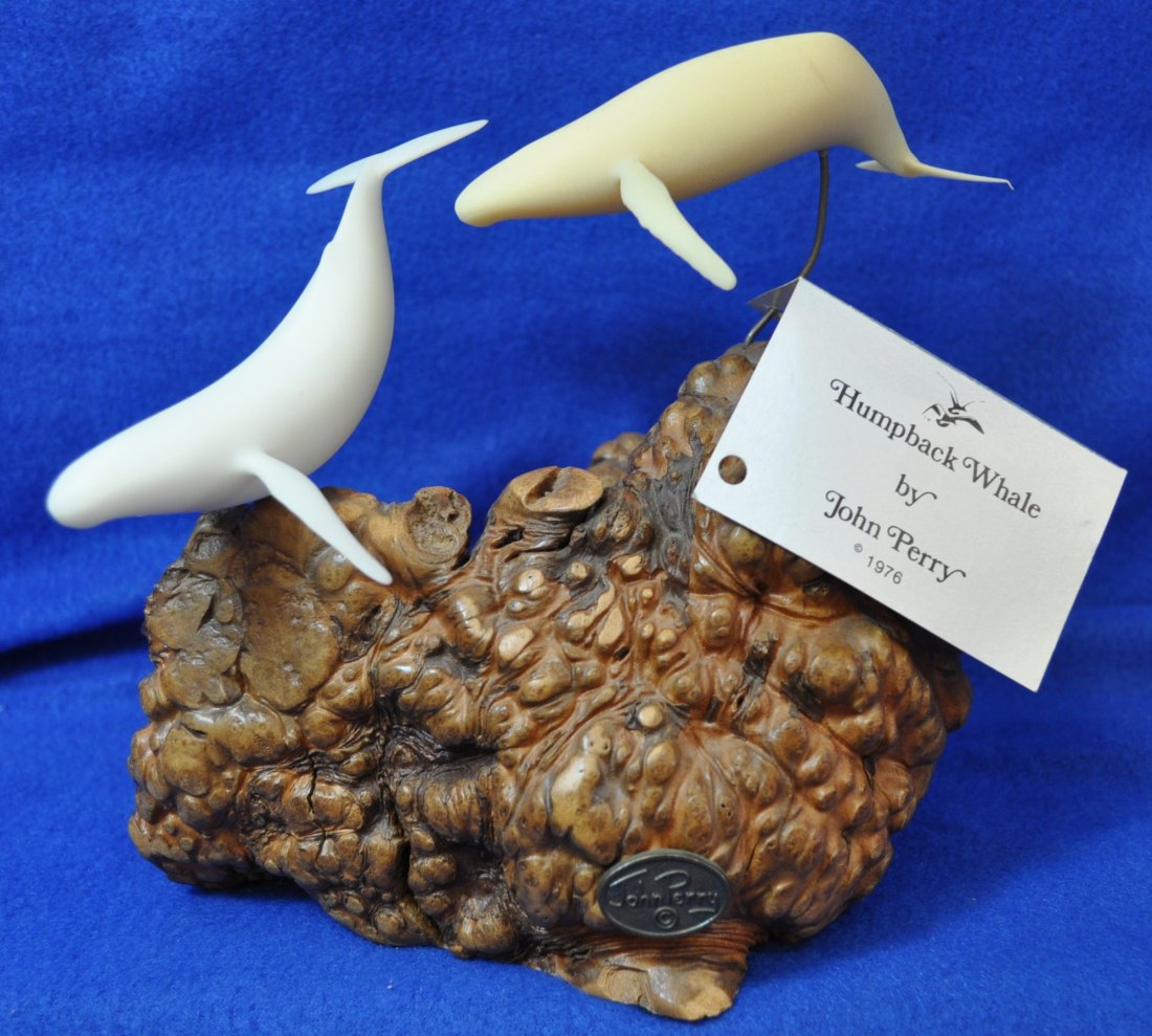JOHN PERRY HUMPBACK WHALE 1976 SCULPTURE BURL XK: We are very pleased to offer this beautiful Humpback Whale Sculpture by John Perry for your bidding consideration. This 1976 sculpture features two Humpback Whales suspended over Burl wood. Each John 