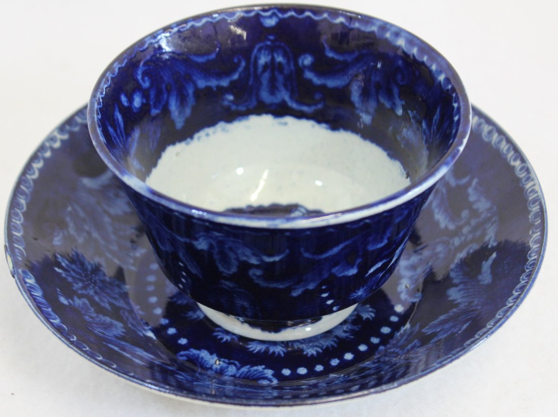 RARE 1818 JAMES RALPH CLEWS DEEP FLOW BLUE CUP SAUCERXG: We are extremely pleased to present this RARE showcase pre-Victorian deep matching Flow Blue cup and saucer by James & Ralph Clews between 1818 & 1834. This incredible matching pair features a gorgeou