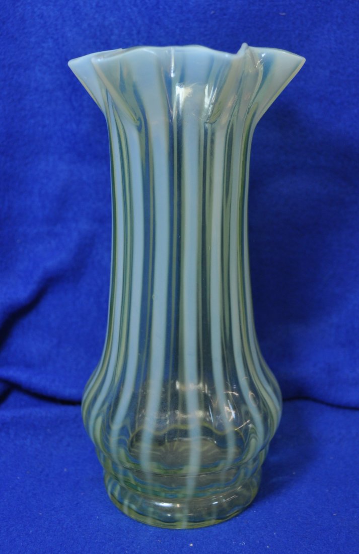 1890s JOHN WALSH WALSH VASELINE OPALESCENT STAR VASE XV: 1890's vertical stripe with 6-point star rim *** Weight : 13 oz. *** Measurements: 3.5x3.5x7.25The AEAA is very pleased to present this next piece of valuable Vaseline Opalescent glass items from the