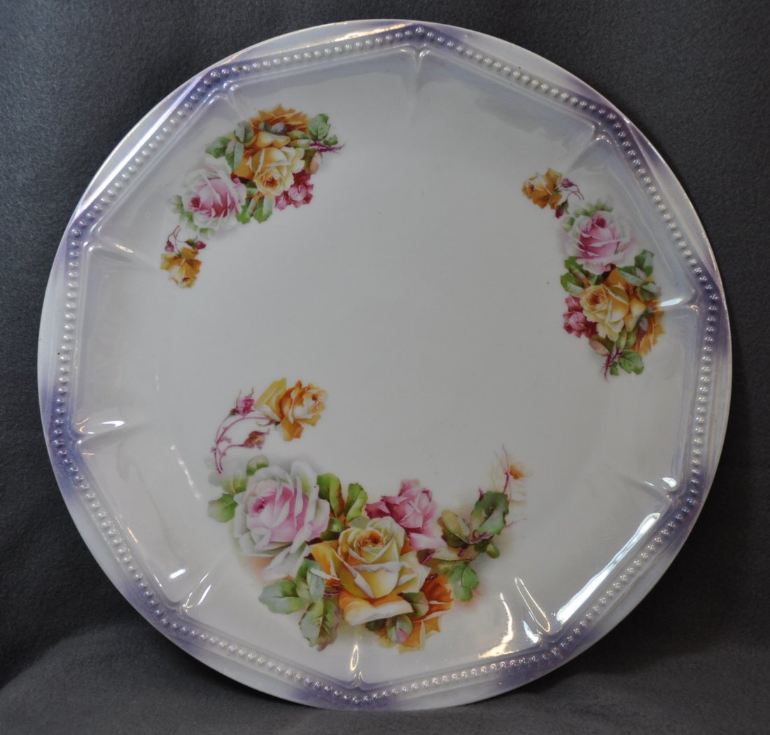 1930s PK SILESIA LUSTER-WARE ROSES TRANSFER CHARGER XJ: The AEAA is pleased to offer this stunning 1930s Bavarian luster-ware porcelain large charger marked PK Silesia. Our charger features brilliant rose bouquets, and the round form sports a 10 faceted & 