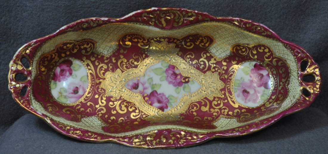 PRE-1921 HP NIPPON HOME MARKET MAROON CELERY DISH XW: The AEAA is very proud to offer this gorgeous pre-1921 hand painted & gilded Nippon celery tray with integral handles. This fine small regional kiln fired dish is unsigned, denoting a Nippon local or 