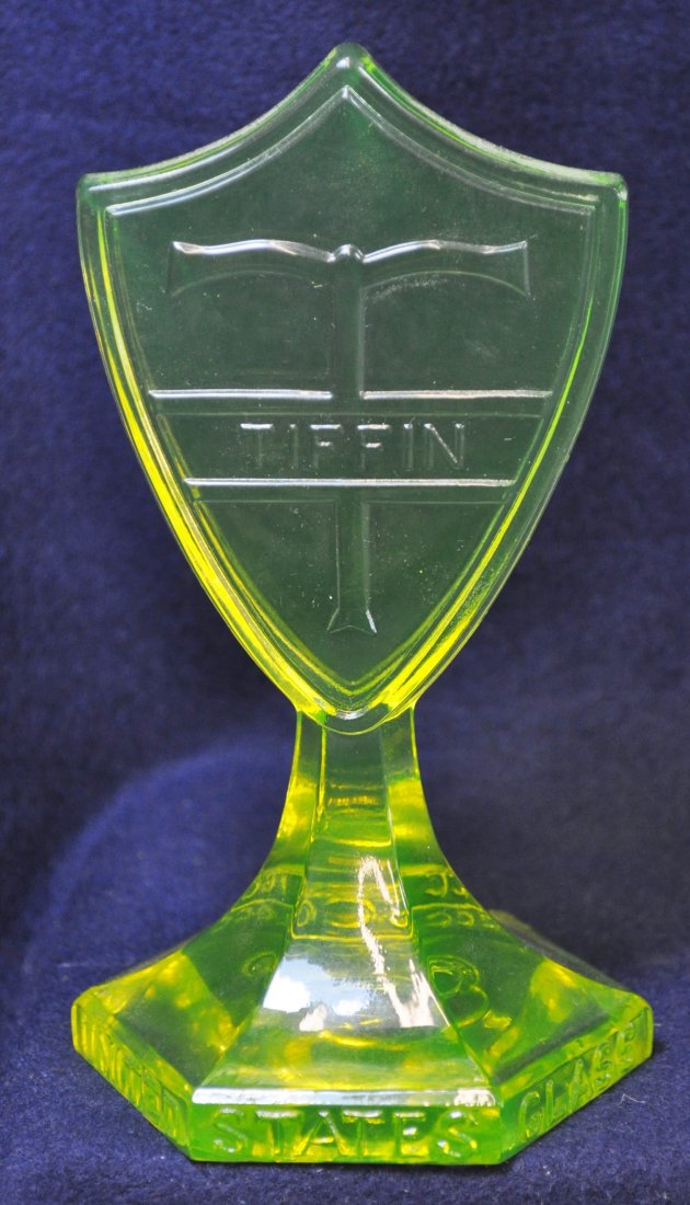 1980s BOYD VASELINE TIFFIN US GLASS TGCC GLASS SIGN XV: 1980S TIFFIN GLASS SHIELD PEDESTAL SIGN FOR TIFFIN GLASS COLLECTORSCLUB (TGCC) W/ U.S. GLASS ON HEXAGONAL BASE "HONORING PLANT # " SCARCE *** Weight: 12 oz. *** Measurements: 3.25x3.25x6 The AEAA is v