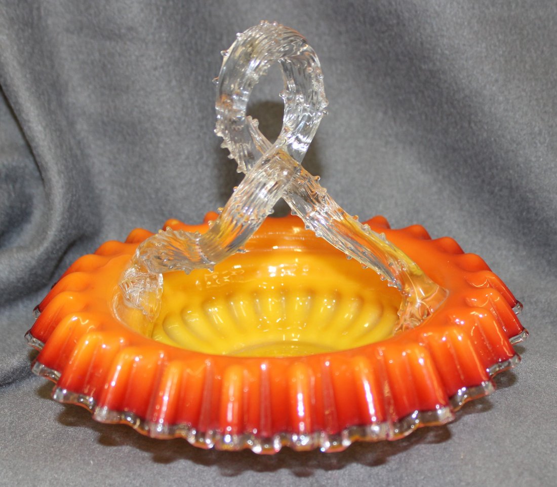 1890s BOHEMIAN GRAF HARRACH HB LOOP HANDLE BASKET XX: The AEAA is pleased to present this stunning 1890s Bohemian Gräf Harrach Glass Factory, hand blown bright red-orange and yellow mottled glass basket, with a rustic looped & reeded thorny rose stem ha
