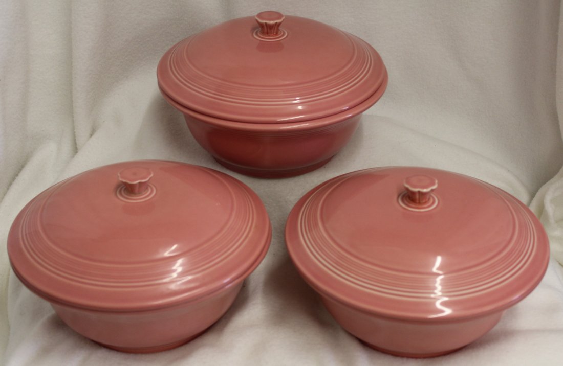 3 NEW FIESTA WARE FLAMINGO COVERED CASSEROLE'S: The following treasure is from the living estate of Ailene & Buddy Ford; noted dealers and lifelong collectors of exceptional antique & vintage heirlooms. This lot is for 3 New Homer Laughlin Fiestawa