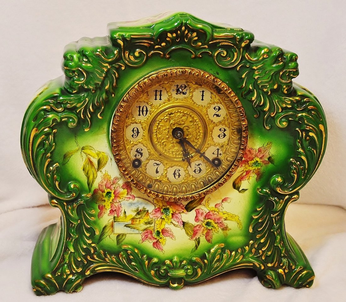 GILBERT DECORATED PORCELAIN MANTEL CLOCK 1898 NO. 411: WE SHIP **** The AEAA is exceptionally pleased to present this lot that represents a early 1898 wonderful W. L. Gilbert & Porcelain HP mantle clock NO. 411. 8-day brass time and strike movement Origin