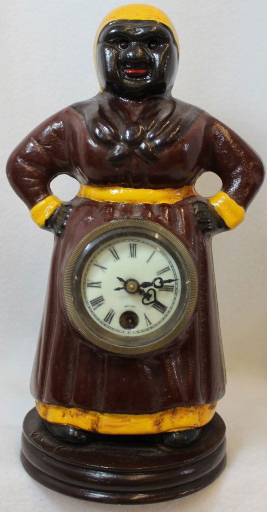 BLINKING / ROCKING EYE CLOCK MAMMY BLACK AMERICANA: The following treasure is from the living estate of Ailene & Buddy Ford; noted dealers and lifelong collectors of exceptional antique & vintage heirlooms. This lot presents the classic Blinking Eye cl