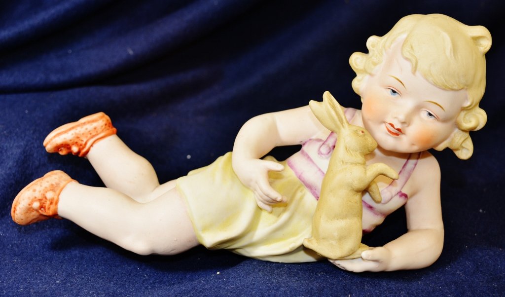 1890s GERMAN LITTLE GIRL PIANO BABY BISQUE FIGURINE: The AEAA is very proud to present this Exceptional & Vintage German Piano Baby virgin bisque prone golden hair little girl and her bunny. Our pair feature realistic flesh tones, and outstanding hand p