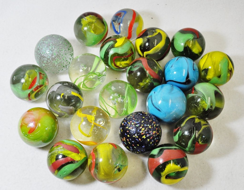 20th CENTURY MACHINE MADE 1.25-1.875 INCH SWIRL MARBLES: WE SHIP! The AEAA is proud to present this stunning lot of (22) 20th century machine made marbles, with an occasional valuable transitional or two included. Our forms represent, multi colored opaque &