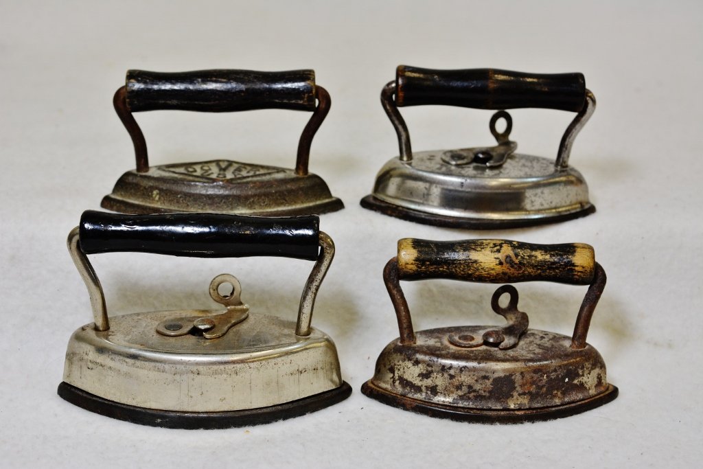 1910 (4) DOVER CORPORATION CAST SAMPLE CHILDS SAD IRONS: The AEAA is proud to present this great lot of (4) 1910s salesmans sample sad irons from The Dover Corporation of Ohio. These exceptional nickel sheathed double ended collar / lace sad irons were desi