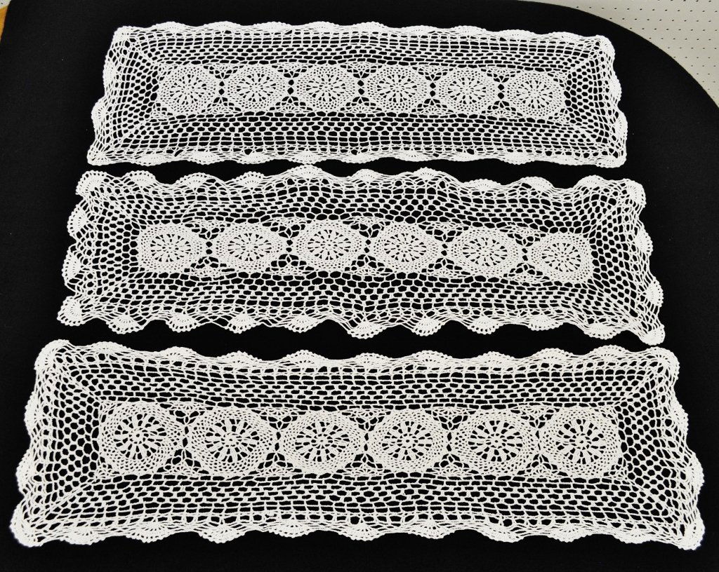 MATCHING LACE TABLE RUNNERS DOILIES WHITE 3 PCS 35x12: Here we have three matching rectangular doilies or runners for your consideration. These are hand crocheted in white and have a lovely pattern with scalloped edges and a center panel of six wheel circ