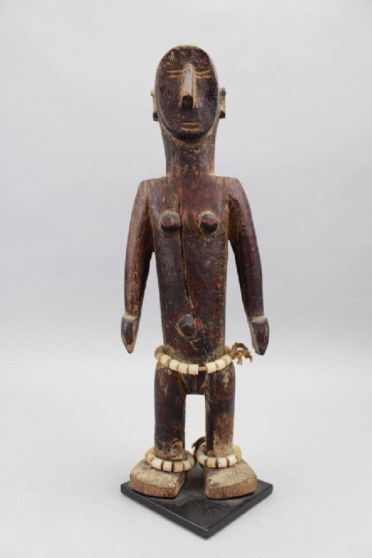 Antique Carved African Figure, Guinea: Antique Carved African Figure on stand, Guinea. Height: 11.5 in.