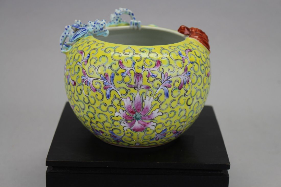 Antique Chinese Qianlong Style Famille Dragon Bowl: Antique Chinese Qianlong Style Yellow Famille Rose Dragon Bowl on stand. With scrolling floral arrangement throughout and a dragon sitting on the rim of the bowl. Signed on base. Height: 3.5 in.